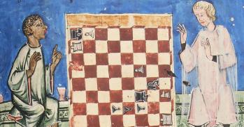 A Black chess player about to win against a light-skinned cleric. Chess problem 88 in the Libro de axedrez, dados e tablas (Seville, 1283). Credit: Patrimonio Nacional. Real Biblioteca del Monasterio de El Escorial