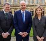 Taoiseach Micheál Martin, centre, with Vice-Chancellor Professor Deborah Prentice (right) and Professor Alvin Jackson (left)
