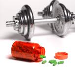 Dumbbell weights in gym with pills