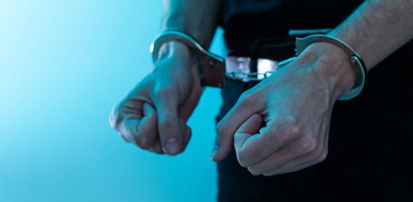 Hands in handcuffs