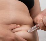 A woman makes a weekly subcutaneous injection of Semaglutide in the stomach