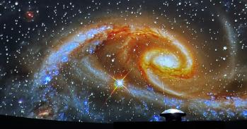 Vividly colourful galaxy projected on the inside of the pop-up planetarium.