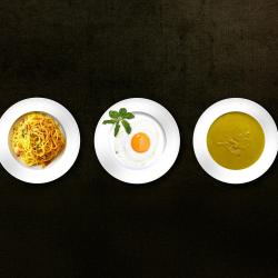Five plates of food in a row
