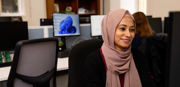 A member of staff using a computer