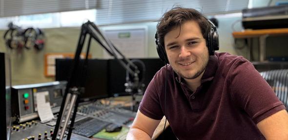 Stefan in front of a radio sound desk